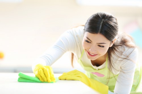 Technician handling cleaning products and equipment carefully